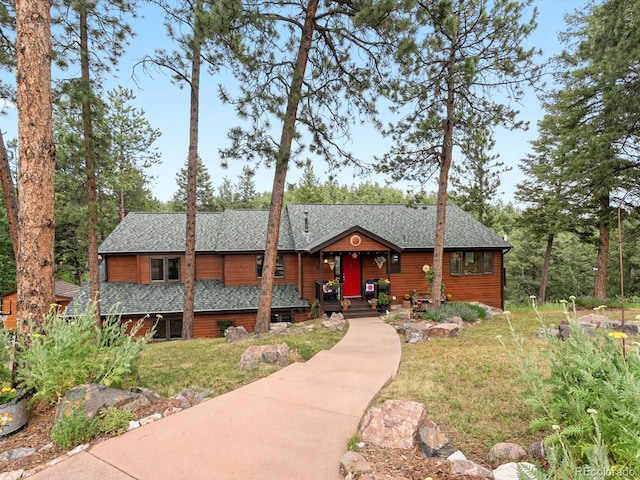 19795 Flint Ln, Morrison, CO 80465 - view of front of house featuring a front yard and a shingled roof