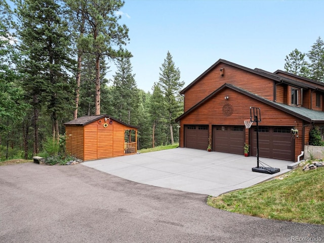 19795 Flint Ln, Morrison, CO 80465 - garage featuring concrete driveway