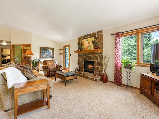 19795 Flint Ln, Morrison, CO 80465 - living area featuring light carpet, healthy amount of natural light, lofted ceiling, and a stone fireplace