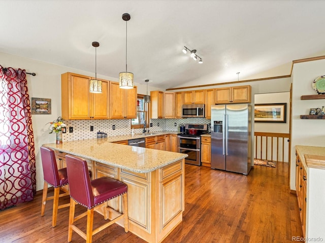 19795 Flint Ln, Morrison, CO 80465 - kitchen with appliances with stainless steel finishes, a peninsula, lofted ceiling, backsplash, and wood finished floors