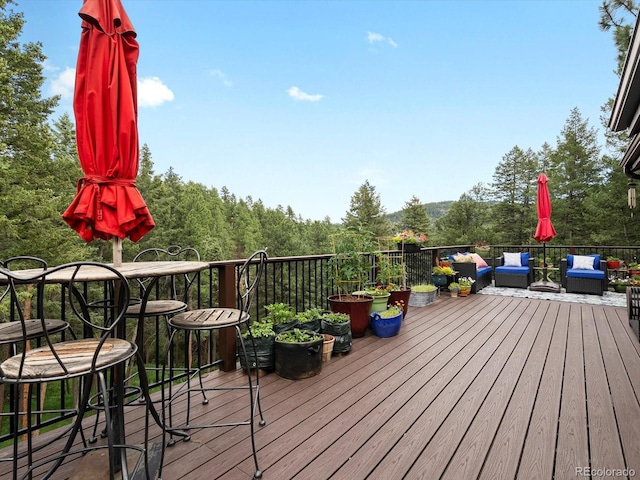 19795 Flint Ln, Morrison, CO 80465 - wooden terrace featuring an outdoor hangout area