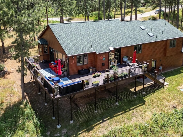 19795 Flint Ln, Morrison, CO 80465 - back of property featuring a shingled roof, a wooden deck, and a yard