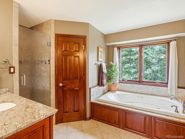19795 Flint Ln, Morrison, CO 80465 - bathroom with a stall shower, a jetted tub, tile patterned flooring, and vanity