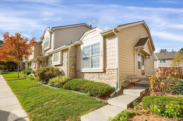 view of property exterior featuring a lawn