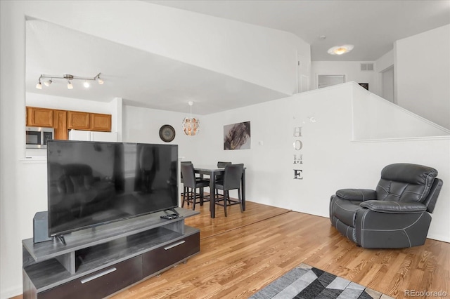 living room with light hardwood / wood-style floors