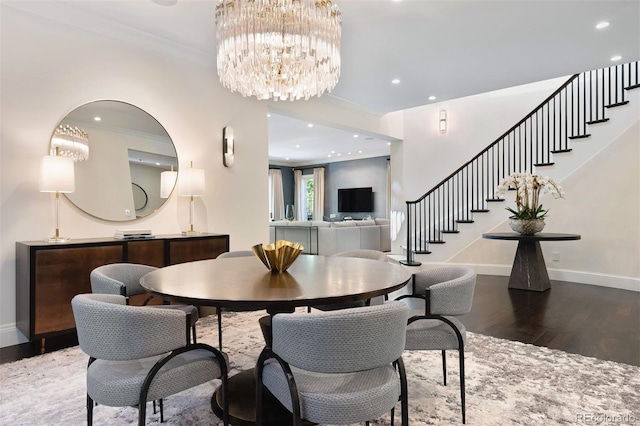 450 Steele St, Denver, CO 80206 - dining area with wood finished floors, stairway, a chandelier, recessed lighting, and ornamental molding