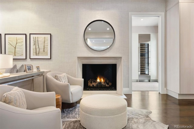450 Steele St, Denver, CO 80206 - living area with wood finished floors, a fireplace with flush hearth, and recessed lighting