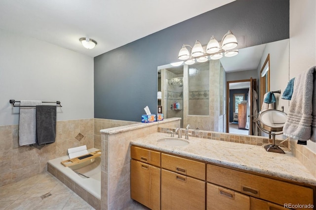25357 Snyder Ave, Conifer, CO 80433 - bathroom featuring tiled shower, tile patterned floors, vanity, and tile walls