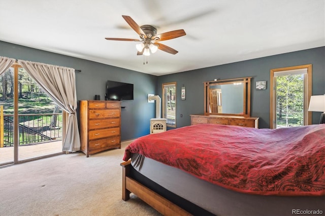 25357 Snyder Ave, Conifer, CO 80433 - carpeted bedroom featuring access to outside and ceiling fan