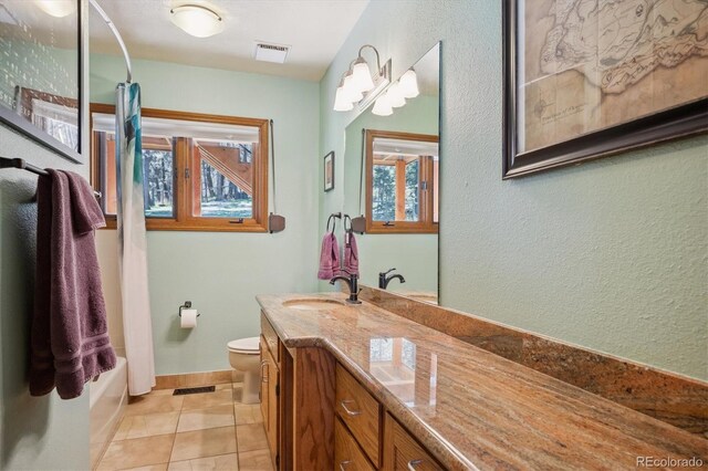 25357 Snyder Ave, Conifer, CO 80433 - full bathroom with toilet, vanity, baseboards, a textured wall, and tile patterned flooring