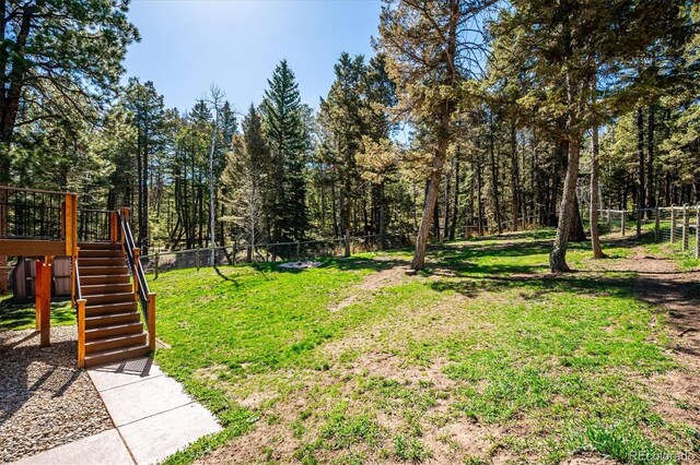 25357 Snyder Ave, Conifer, CO 80433 - view of yard with stairs and a deck