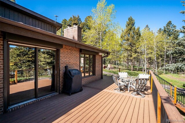 25357 Snyder Ave, Conifer, CO 80433 - deck featuring grilling area and outdoor dining area