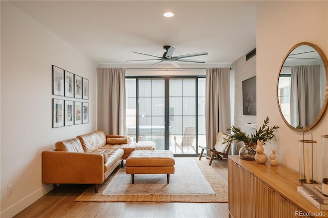 living room with recessed lighting, baseboards, ceiling fan, and light wood finished floors