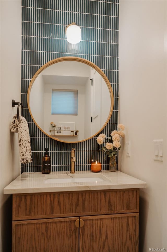 bathroom featuring decorative backsplash and vanity