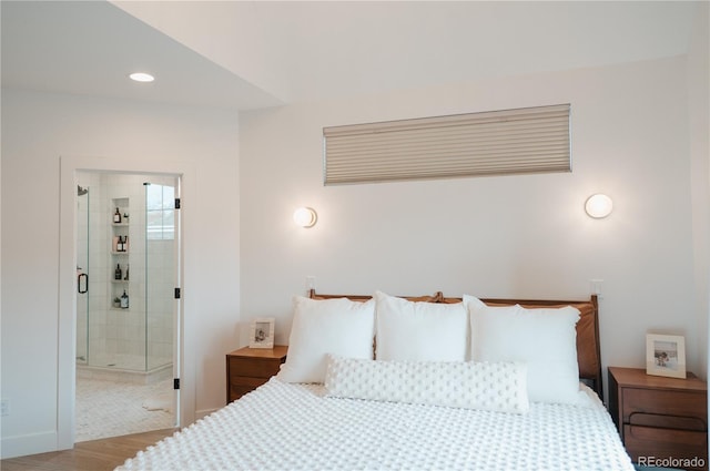 bedroom featuring recessed lighting and wood finished floors