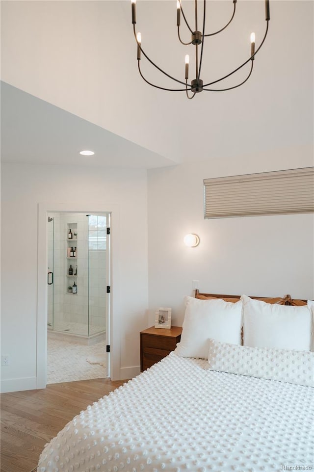 bedroom featuring connected bathroom, baseboards, a chandelier, recessed lighting, and wood finished floors