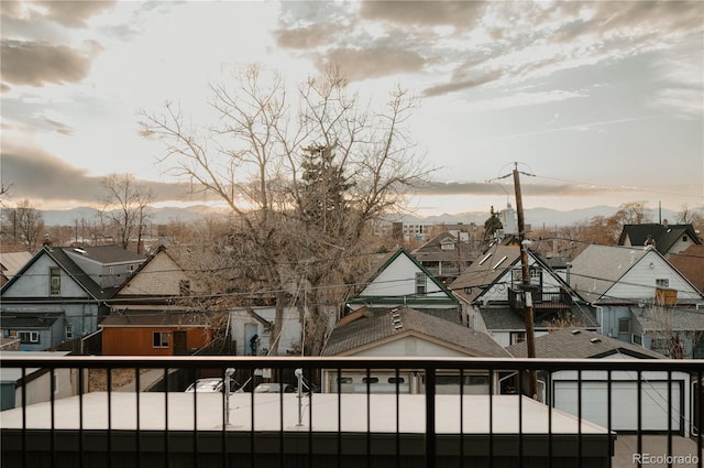 property view of water with a mountain view and a residential view