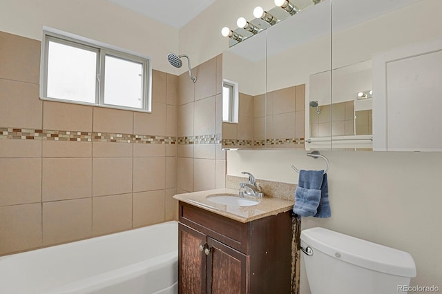 bathroom featuring toilet, bathtub / shower combination, and vanity