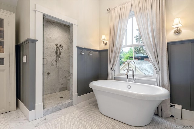 4535 E Montview Blvd, Denver, CO 80207 - full bathroom with marble finish flooring, wainscoting, a freestanding bath, a stall shower, and a baseboard heating unit