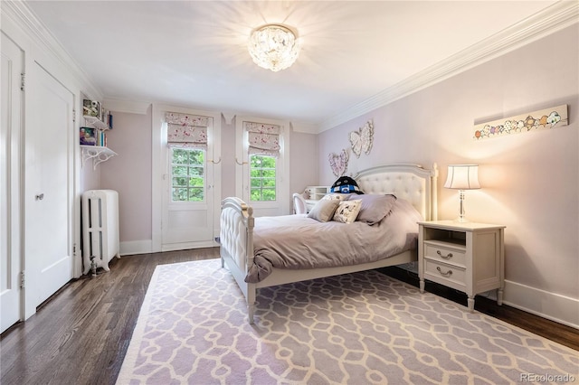 4535 E Montview Blvd, Denver, CO 80207 - bedroom with radiator, dark wood-type flooring, crown molding, baseboards, and a chandelier