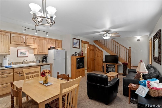 2625 Marys Lake Rd Unit 18C, Estes Park, CO 80517 - dining space with stairs, a chandelier, and a ceiling fan