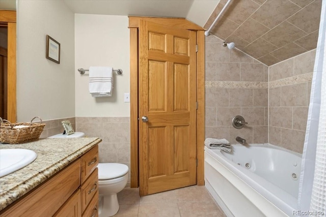 2625 Marys Lake Rd Unit 18C, Estes Park, CO 80517 - bathroom with tile patterned floors, tile walls, vanity, a combined bath / shower with jetted tub, and lofted ceiling