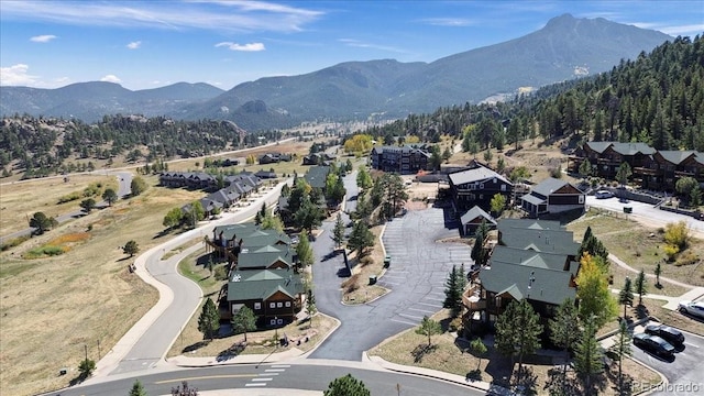 2625 Marys Lake Rd Unit 18C, Estes Park, CO 80517 - aerial overview of property's location with a mountain backdrop and nearby suburban area