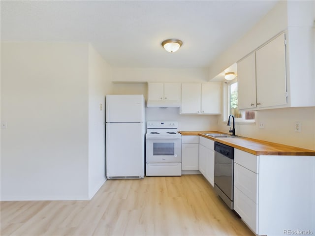 kitchen with sink, white appliances, white cabinets, and light hardwood / wood-style flooring