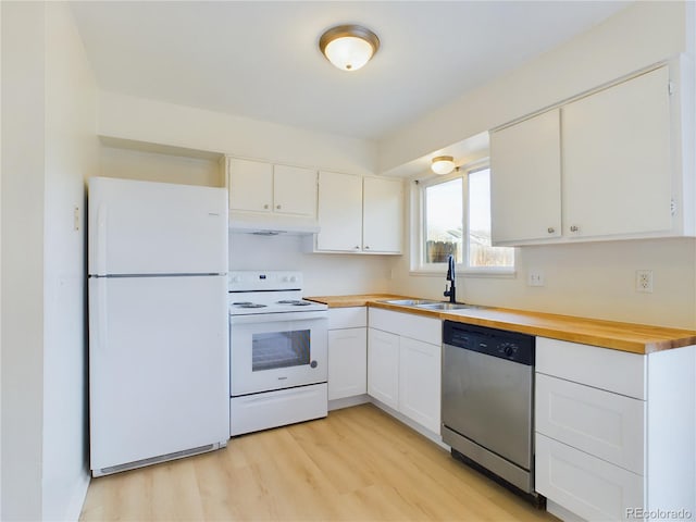 kitchen with butcher block counters, white appliances, light wood-type flooring, white cabinets, and sink