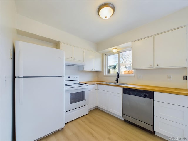 kitchen with sink, white appliances, white cabinetry, and light hardwood / wood-style floors