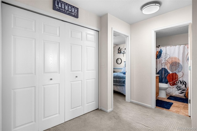19707 E 59th Pl, Aurora, CO 80019 - carpeted bedroom featuring a closet and baseboards
