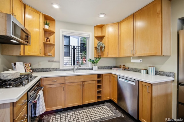 kitchen featuring open shelves, appliances with stainless steel finishes, a sink, light countertops, and recessed lighting