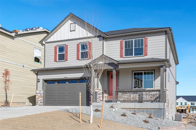 craftsman inspired home featuring a garage, covered porch, and central AC unit