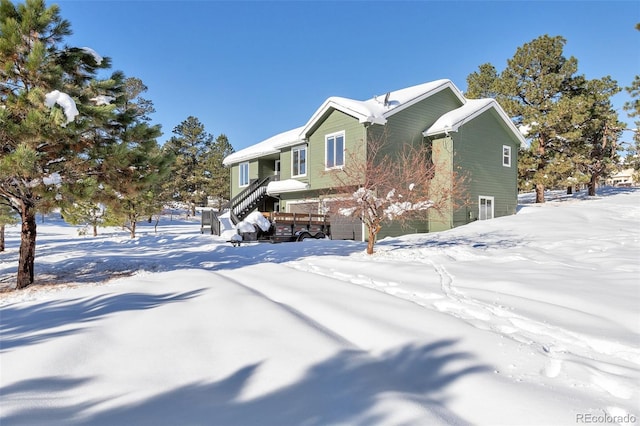 27627 E Broadview Dr, Kiowa, CO 80117 - view of snow covered exterior featuring an attached garage