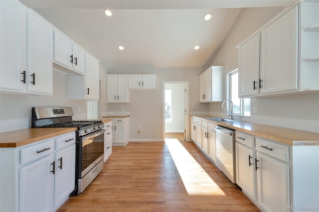 27627 E Broadview Dr, Kiowa, CO 80117 - kitchen featuring stainless steel appliances, a sink, open shelves, light wood-style floors, and baseboards