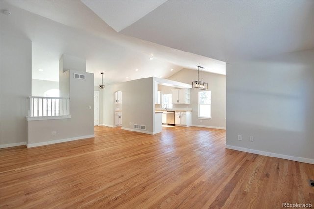 27627 E Broadview Dr, Kiowa, CO 80117 - unfurnished living room with light wood-style flooring, baseboards, and high vaulted ceiling