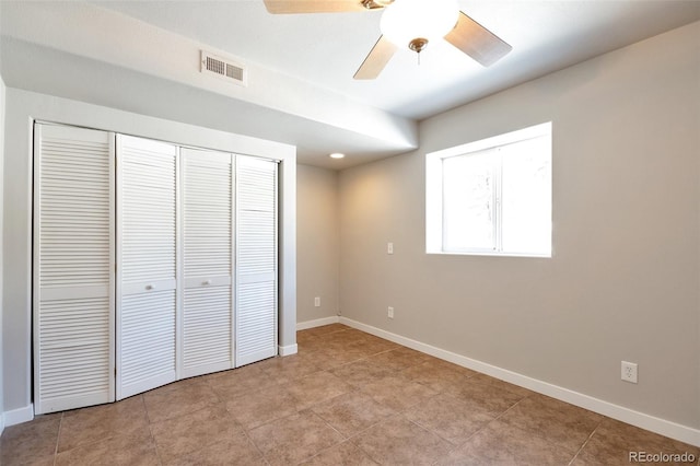 27627 E Broadview Dr, Kiowa, CO 80117 - unfurnished bedroom featuring a closet, baseboards, ceiling fan, and light tile patterned flooring