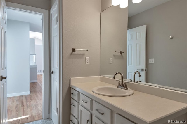 27627 E Broadview Dr, Kiowa, CO 80117 - bathroom with vanity, baseboards, and wood finished floors