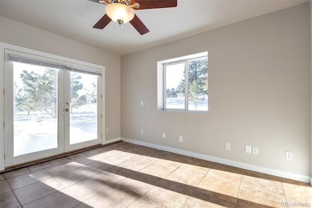 27627 E Broadview Dr, Kiowa, CO 80117 - unfurnished room featuring french doors, baseboards, a ceiling fan, and tile patterned flooring