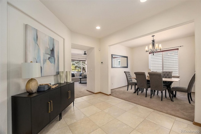 dining room featuring light carpet, light tile patterned floors, recessed lighting, baseboards, and ceiling fan with notable chandelier