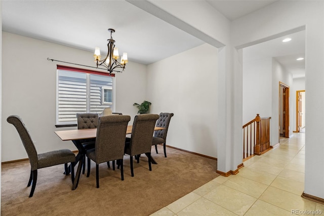 dining area featuring baseboards, light colored carpet, light tile patterned flooring, a notable chandelier, and recessed lighting