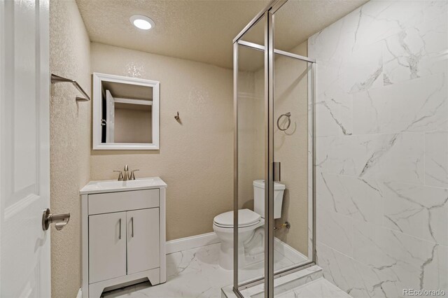 full bath with marble finish floor, toilet, a stall shower, a textured ceiling, and vanity