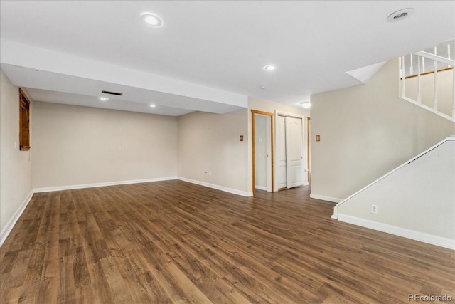 6721 Quay Ct, Arvada, CO 80003 - finished basement with dark wood-style floors, stairs, and recessed lighting