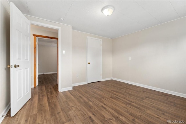 6721 Quay Ct, Arvada, CO 80003 - unfurnished bedroom with wood finished floors and baseboards