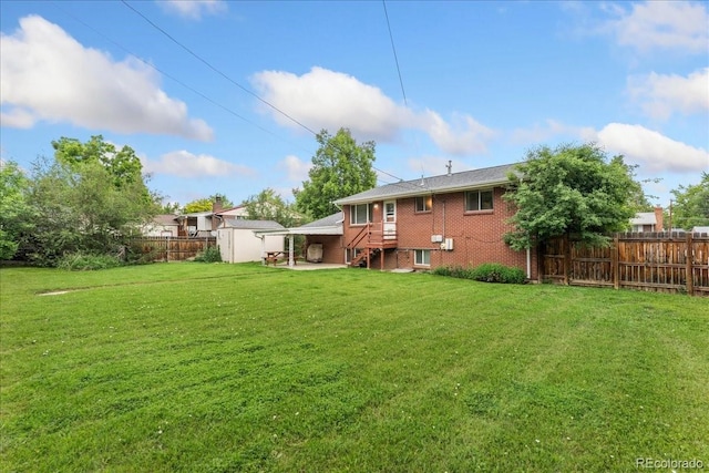 6721 Quay Ct, Arvada, CO 80003 - back of house featuring a storage unit and brick siding