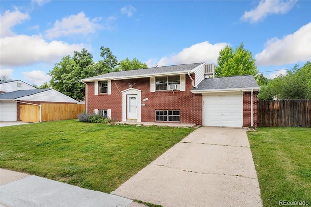 6721 Quay Ct, Arvada, CO 80003 - raised ranch featuring an attached garage, brick siding, and concrete driveway