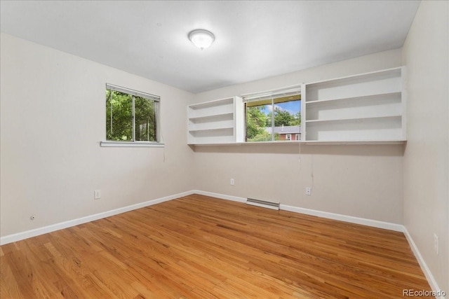 6721 Quay Ct, Arvada, CO 80003 - unfurnished room with healthy amount of natural light and light wood-style floors