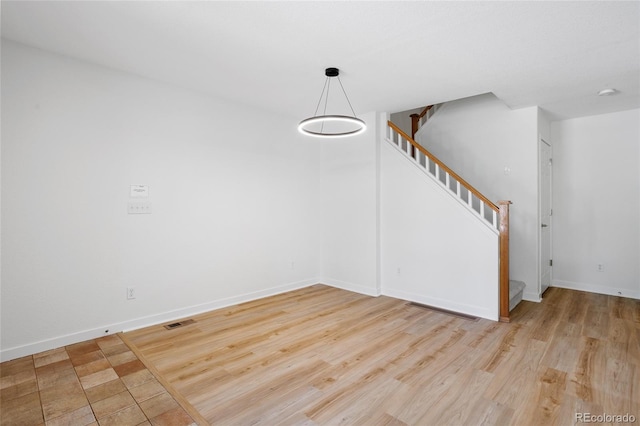 14247 Pikeminnow Pl, Broomfield, CO 80023 - unfurnished dining area with stairs, wood finished floors, and baseboards