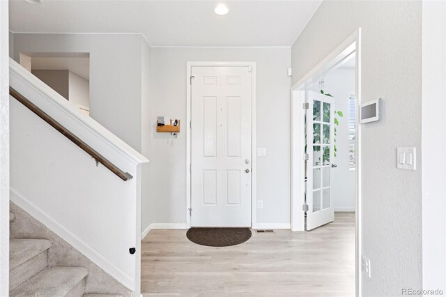 4280 Pioneer Pl, Brighton, CO 80601 - entryway with wood finished floors, stairs, and baseboards