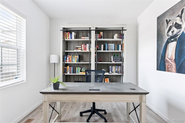 4280 Pioneer Pl, Brighton, CO 80601 - office area featuring baseboards, wood finished floors, and healthy amount of natural light